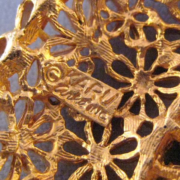 Karu Goldtone and Black Rhinestone Floral Motif Crescent Pin