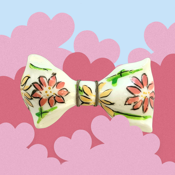 White Plastic Bow Pin with Enameled Flowers